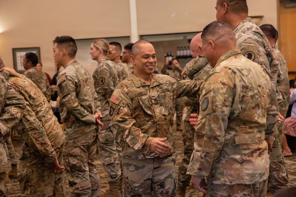 Hawaii Army National Guard Soldiers greet one another during a welcome-home ceremony at Schofield Barracks, Hawaii, January 17, 2026.