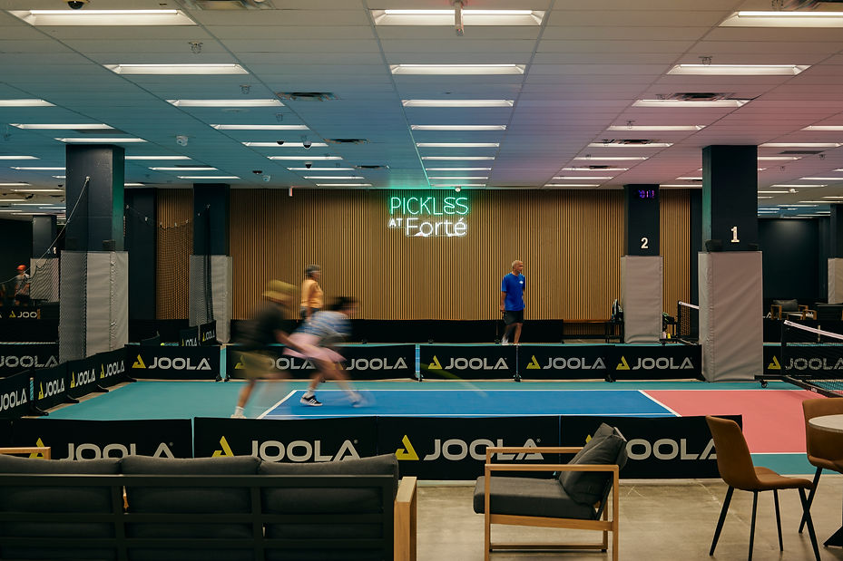 Indoor pickleball courts at Pickles at Forté in downtown Honolulu