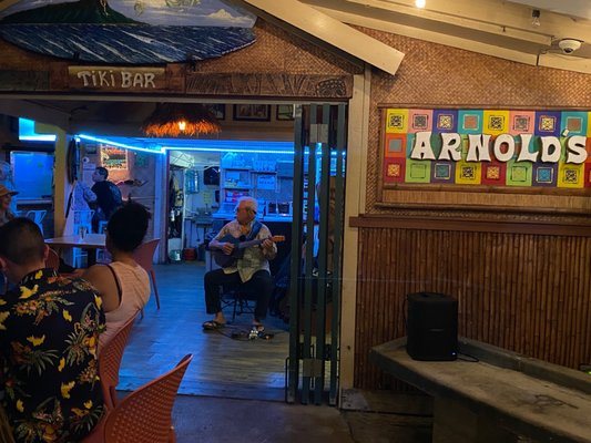 Live ukulele performance inside Arnold’s Beach Bar, Waikīkī