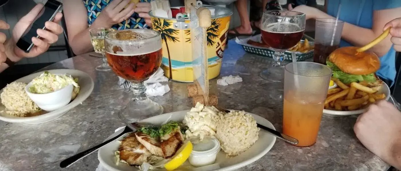 Harbor House Kona food and drinks at a harbor-view table