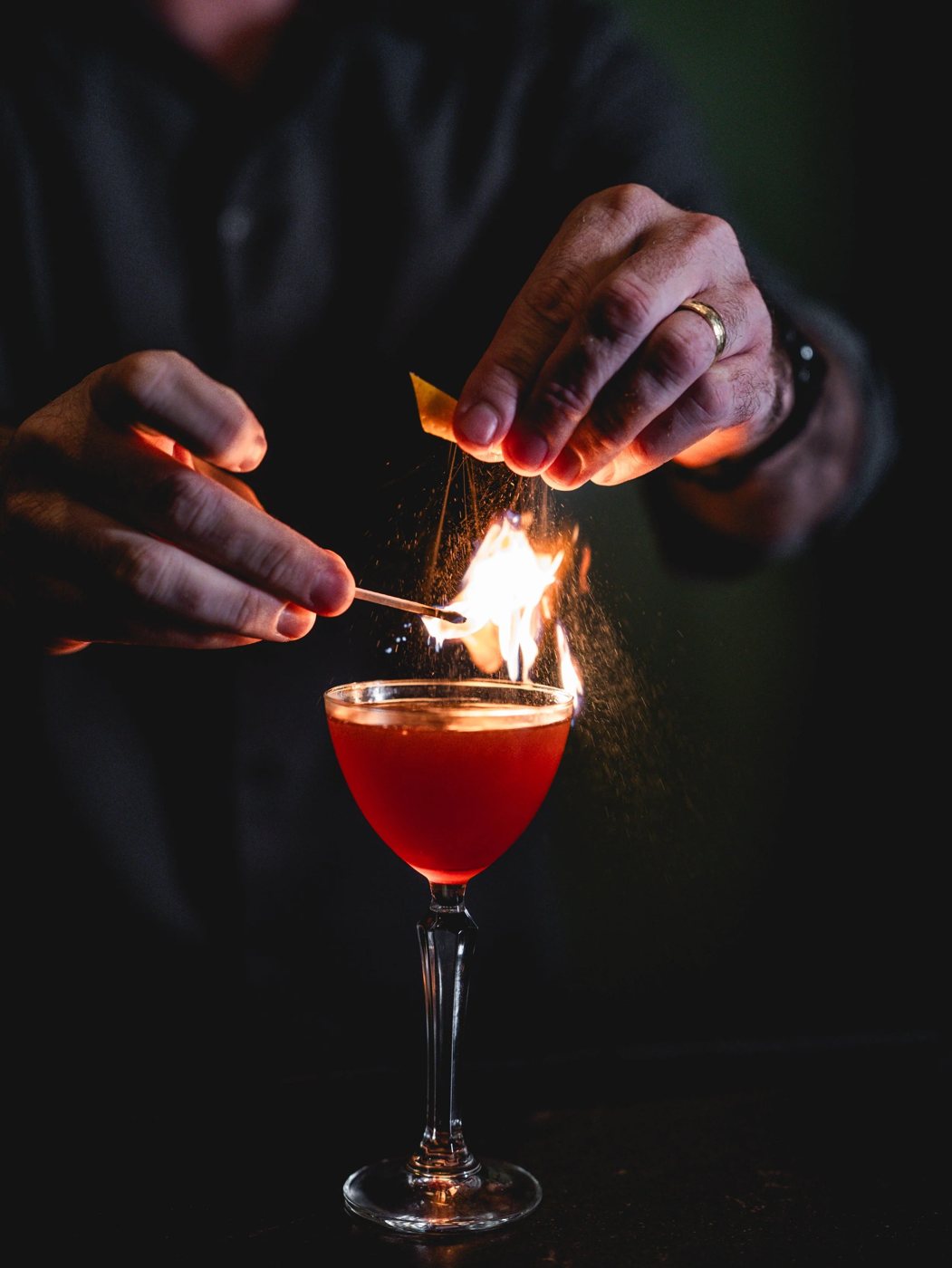 A flaming cocktail prepared at Vintage Books Hawaiʻi