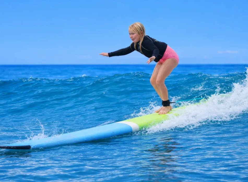 A surfer pictured in North Shore Surf Girls’ GoHawaii listing.