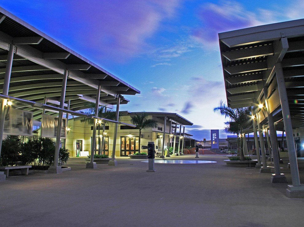 An evening photo of the Pearl Harbor Visitor Center Complex looking towards the museums.