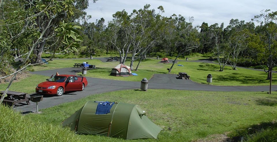 Tents in the grassy Nāmakanipaio Campground.