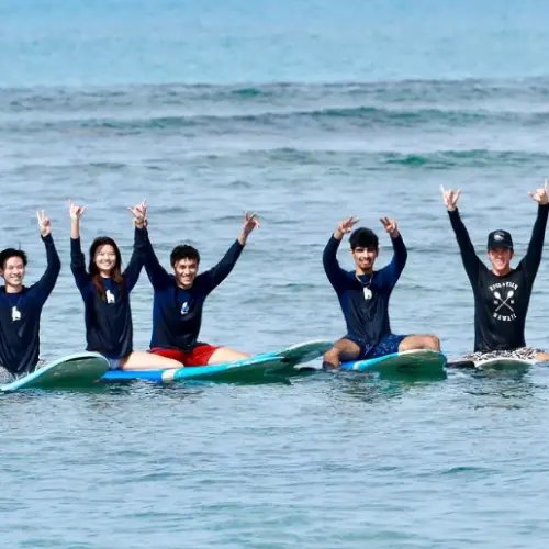 A group surf lesson pictured on Hans Hedemann Surf School’s official website.