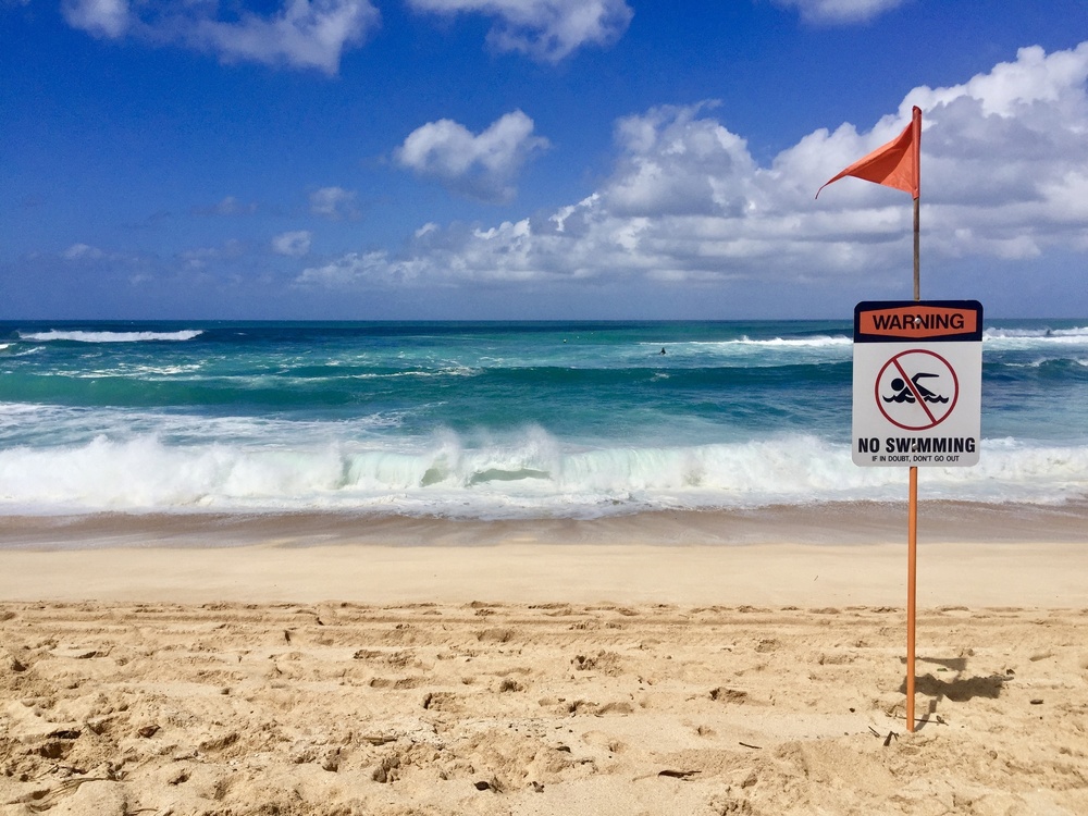 Heavy surf and a no-swimming warning at Sunset Point Beach Park, Oʻahu (October 2015)