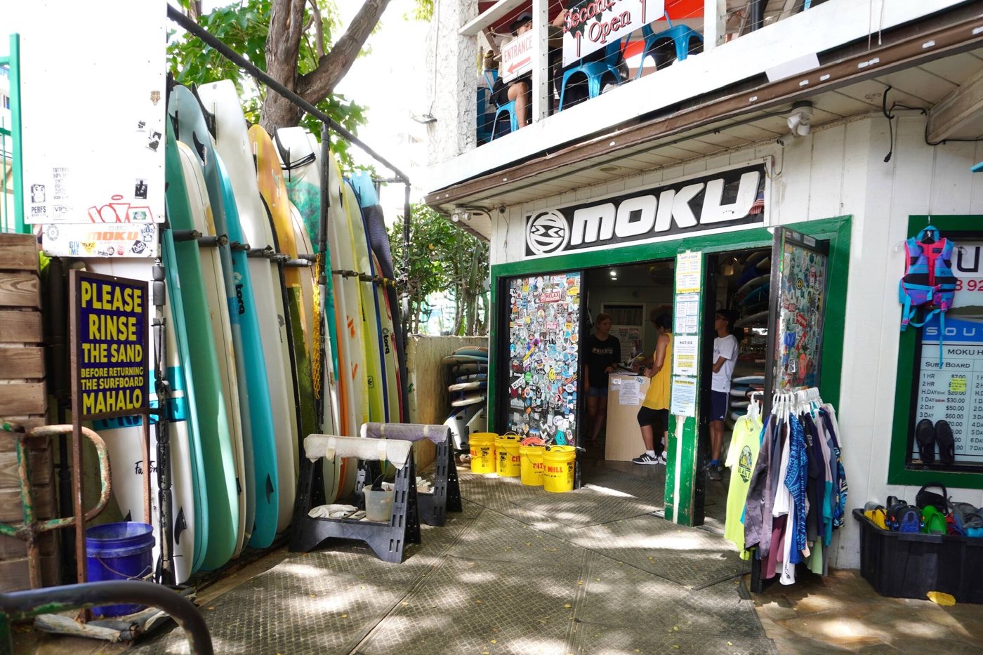 Moku Hawaii surf shop entrance and rental surfboards in Waikīkī.