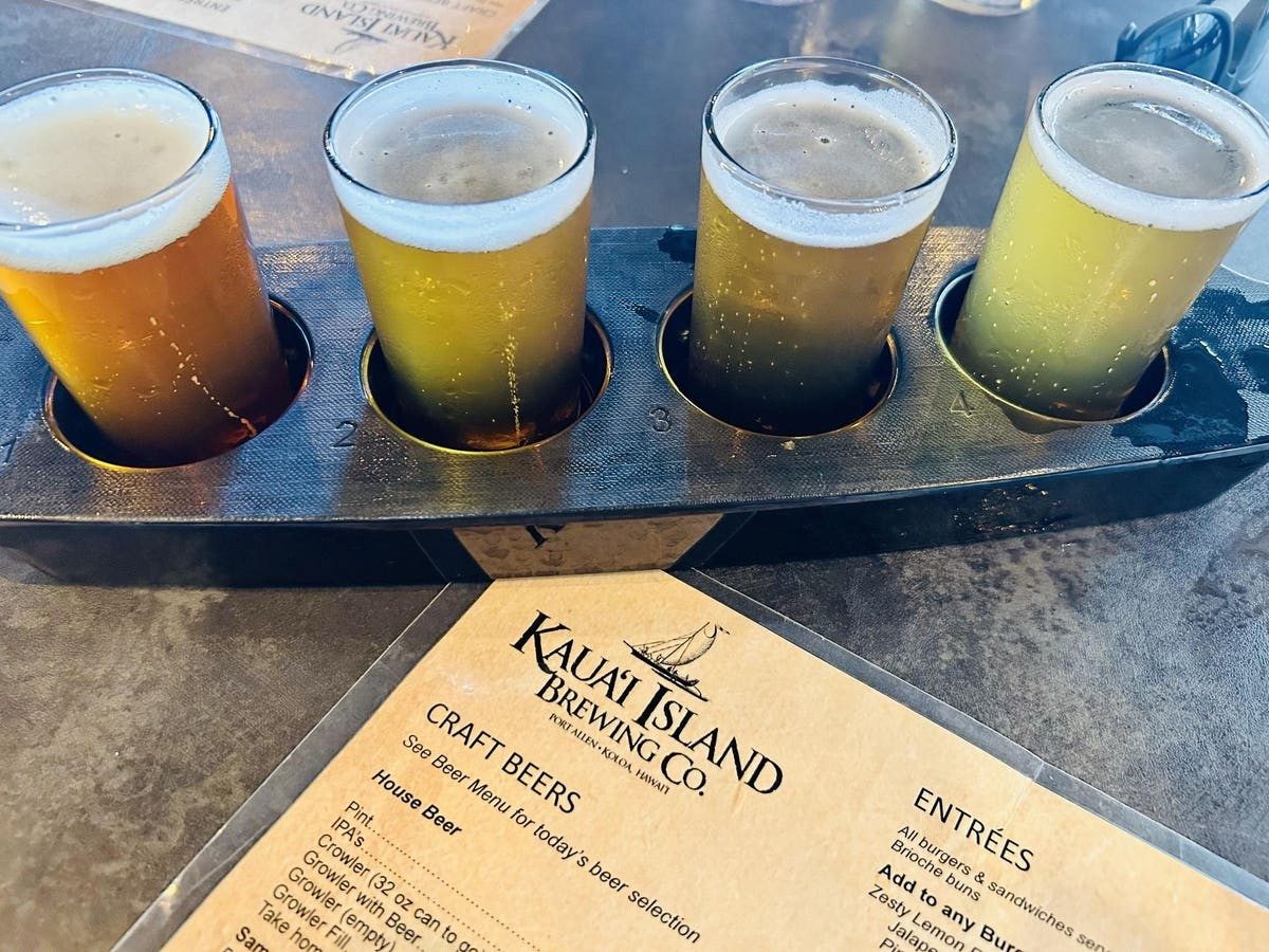 Kauaʻi Island Brewing beer flight — brand-level photograph taken at Port Allen, not the Kōloa branch