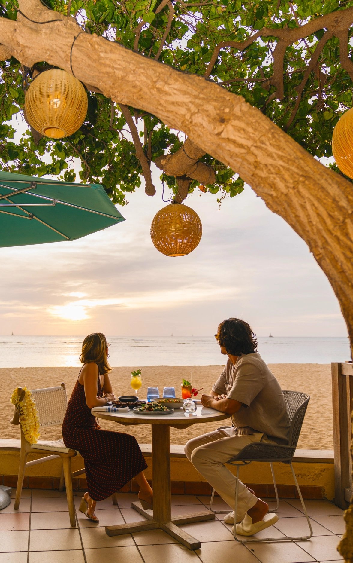Beachfront dining under the Hau Tree at Kaimana Beach Hotel