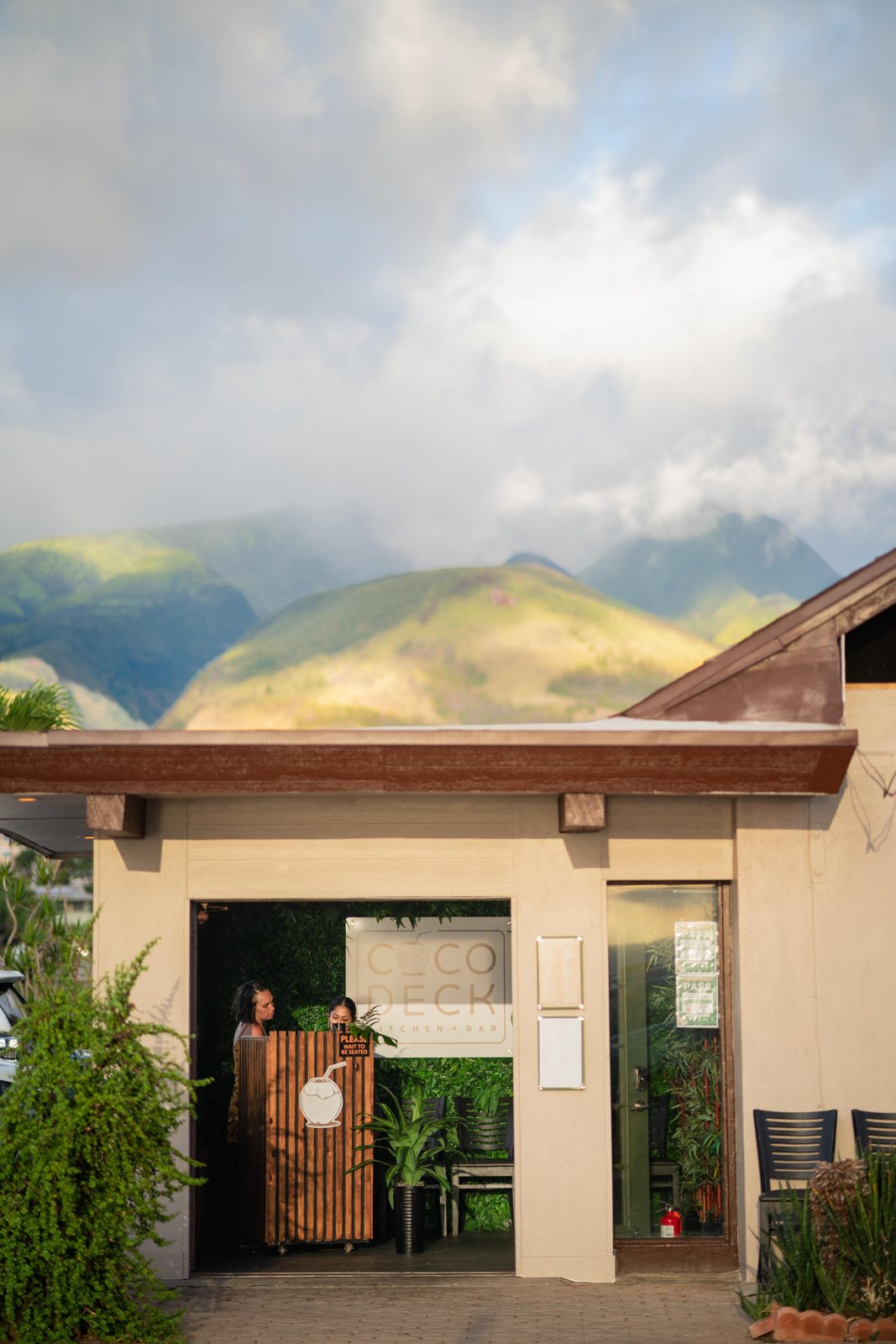 Coco Deck entrance with the West Maui mountains behind it.